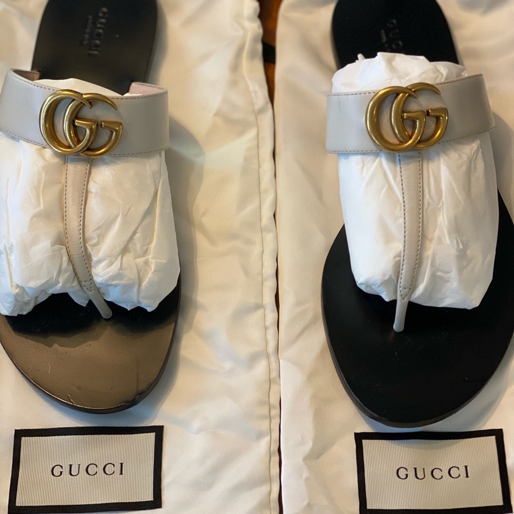 Gently used white Gucci sandals.